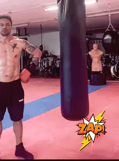 Man hits punching bag with zap effect