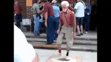 Old man dances then gets hit by another man