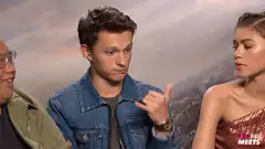 Tom Holland makes a hand gesture