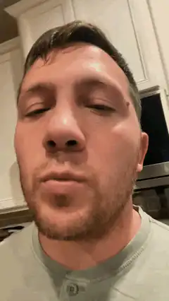 Man closes eyes and turns head