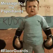 Baby in boxing gloves message to paperhands