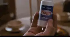 Man takes Viagra pill
