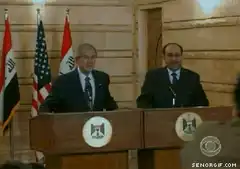 Muntadhar al-Zaidi throws shoes at George W. Bush
