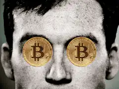 Man with Bitcoin coins for eyes
