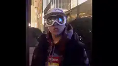 Person in ski goggles and Supreme hoodie