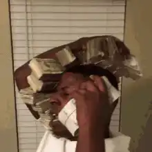 Man with stacks of money on his head