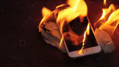 burning smartphone on cloth