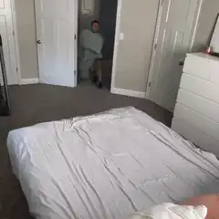 Man rolls into bed with blanket