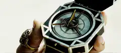 Hand holding spinning compass