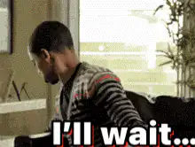 I'll wait... man eating popcorn