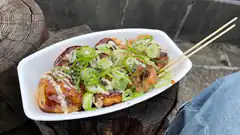 takoyaki with chopsticks on stump