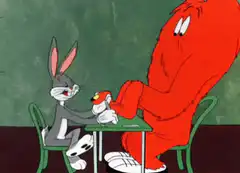 Bugs Bunny and the Grinch at a table