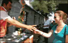 Man pouring tea into woman's shoe