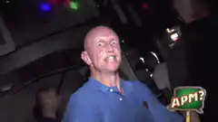Bald man dancing excitedly