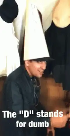 Man wearing dunce cap