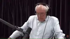 Rich Harris looking down at microphone