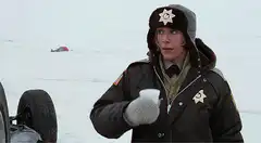 Sheriff MacReady drinks coffee in the snow