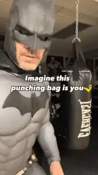 Batman punches punching bag