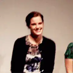 Emma Watson laughing and covering face
