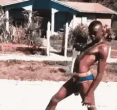 Man in blue underwear dancing outside