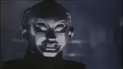 Robot head turns and smiles