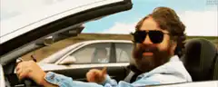 Zach Galifianakis giving a thumbs up in a car