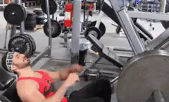 guy doing leg press then bench press