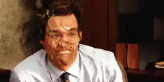 Jim Carrey with face mask waving