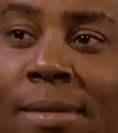Man squinting and frowning