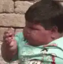 Baby turns head and looks at camera