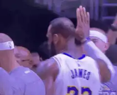 Kyle Kuzma high fives LeBron James