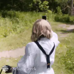 Moira Rose taking a selfie