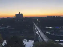 sunset over city bridge