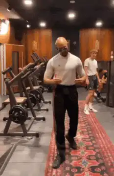 Bald man dancing in gym