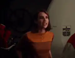 Woman lifts shirt to reveal eyes