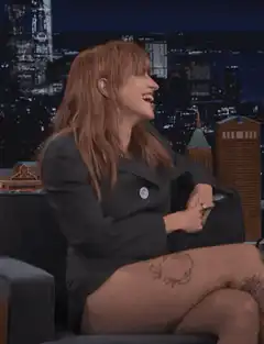 Bella Thorne laughing and making hand gestures