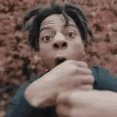 Man with dreadlocks making shocked face