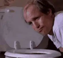 Man vomiting into toilet