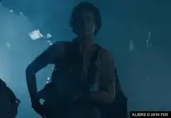 Soldier uses flamethrower on alien eggs