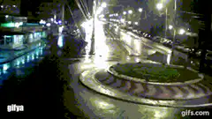 Car crashes into roundabout at night