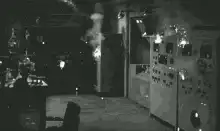 Vintage laboratory equipment sparking and smoking