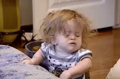 Toddler crying and shaking head