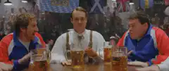 Three men drinking beer in a pub