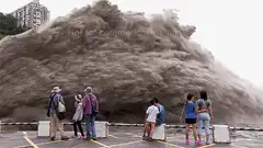 People watching a giant wave