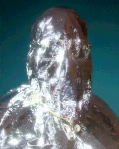 Man in foil suit melting