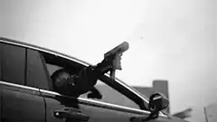 gunman shooting from car window