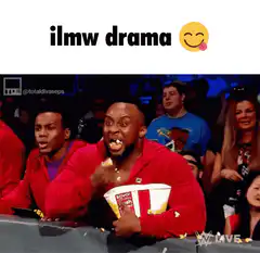 Man eating popcorn with popcorn in mouth