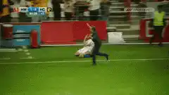 Fan tackles soccer player on field