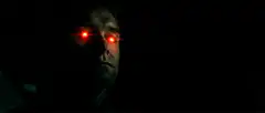 Man with glowing red eyes