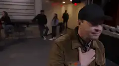 Man puts hand on chest and smiles